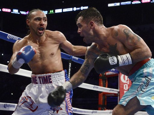 Diego Chaves, right, of Argentina, and Keith Thurman exchange punches during a welterweight title boxing match, Saturday, July 27, 2013, in San Antonio. Thurman won by KO in the 10th round