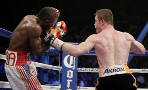 Canelo Alvarez, right, of Mexico, lands a punch on&nbsp;&hellip;