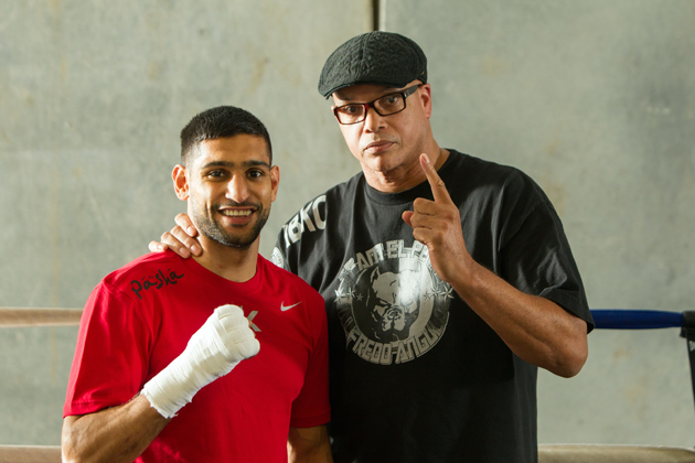Amir Khan poses with his trainer Virgil Hunter at Hunterâ€™s gym on April 24 in Hayward, Calif., as he prepares to take on Luis Collazo at the MGM Grand in Las Vegas on May 3. Photo by Alexis Cuarezma/Getty Images